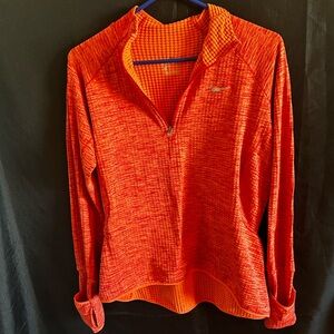 Nike medium women’s 1/4 zip dri-fit long sleeve shirt.